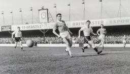 Billy Bingham in a chase for the ball
