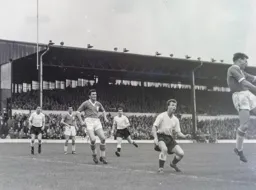 Allan Brown, Joe McBride and Billy Bingham wait for the ball to come over