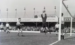 Seamus Dunne replacing the badly injured Ron Baynham in goal