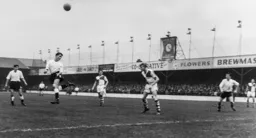 Les Spencer gets his head to the ball
