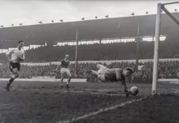 Alec Ashworth watches the ball tipped around the post