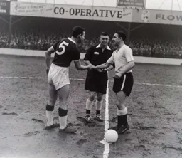 Northampton's Colin Gale and Luton skipper Bob Morton shake hands before the start