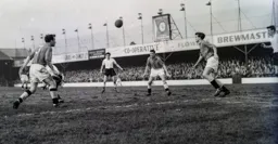 Derby defenders converge on the ball