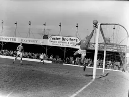 Liverpool keeper Jim Furnell tips the ball over