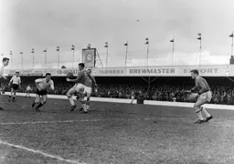 Alec Ashworth heads the ball past Liverpool's Ron Yeats