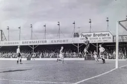 Ron Baynham is first to the ball