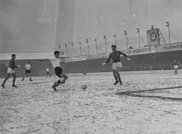 Gordon Turner fires in a shot watched by Chelsea defender John Mortimore
