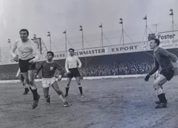 Terry Kelly gets in front of Swindon's Ernie Hunt