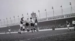 The ball is headed clear by Dave Pacey