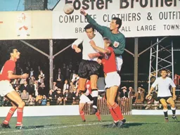 Tommy McKechnie challenges Cherries goalkeeper David Best