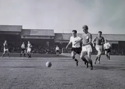 Tommy McKechnie up against Bournemouth's Roy Gater