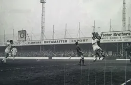 Tommy McKechine goes up with Reading keeper Arthur Wilkie
