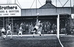 Millwall keeper Alex Stepney punches the ball clear