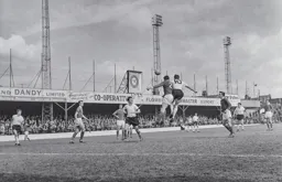 John Reid nods the ball down to the waiting Harry Walden