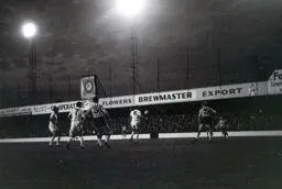 A long range shot flashes past a watching Tommy McKechnie