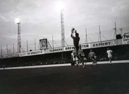 Tommy McKechnie races in as Port Vale keeper Ken Hancock catcches the ball