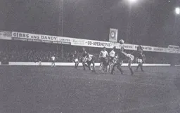 A Villa defender hooks the ball clear as Tommy McKechnie and John O`Rourke look on