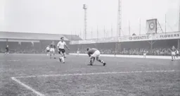 Tommy McKechnie threatens the City goal but Mike Gibson gets to the ball