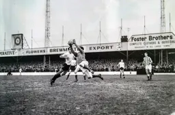 Tommy McKechnie and Sunderland keeper Sandy McLaughlan bravely go for the ball