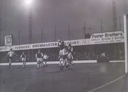 Brighton keeper Brian Powney prevents the ball from reaching Tony Read