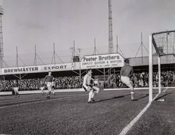 Tony Read threatens the Halifax goal but Bob Raynor safely holds on to the ball