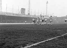 Matt Woods moves forward with the ball after a skirmish on the edge of the Luton penalty area