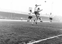 Matt Woods rises highest to head the ball clear of danger