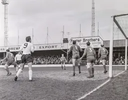 Tommy McKechnie and the City defence watch as the ball has gone wide