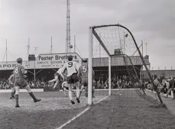 Tommy McKechnie watches as a flying header goes wide of the target