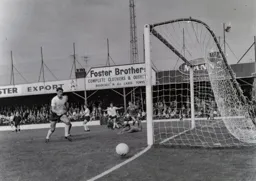 Alan Rivers, Graham French and Gerry King can only look on as the ball just misses the target