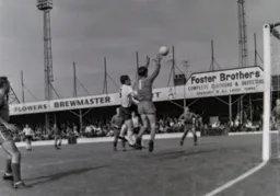 Stockport keeper Steve Fleet prepares to catch the ball under pressure from Graham French