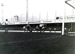 Bruce Rioch puts Gordon Phillips under pressure as he gathers the ball