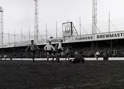Bruce Rioch sees his shot blocked by Gordon Phillips in the Brentford goal