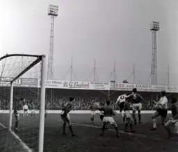 Bruce Rioch heads the ball across the penalty area