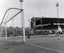 City keeper Colin Treharne makes a routine save as Ray Whittaker runs in