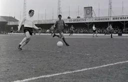 Graham French is closed down by Tommy Brooks as he attempts to cross the ball
