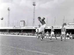 An opened mouthed Mick Brown watches as the ball is headed clear