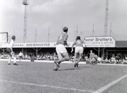Barnsley keeper Ray Wood makes a spectacular clearance as Keith Allen looks on