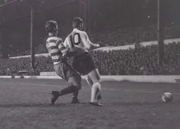 Bruce Rioch shields the ball away from Ron Goodison