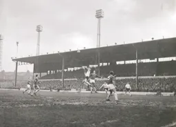 Keith Allen gets his head to the ball