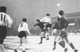 Bruce Rioch heads an attempt wide