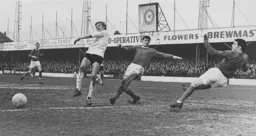 Keith Allen joins the Rochdale defenders in falling over