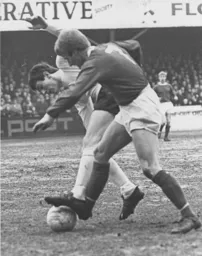Bruce Rioch fights for the ball