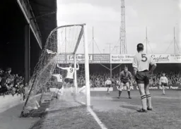 Keith Allen bundles the ball into the net for the first goal