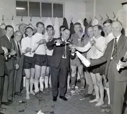 The players celebrate after winning promotion