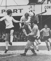 Keith Allen gets his head to the ball