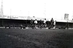 John Ryan gets in between defenders to attempt a header at goal