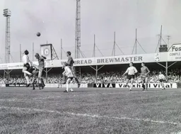 Graham French back heads the ball