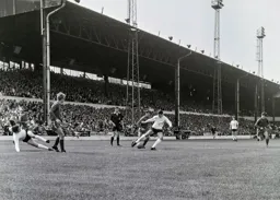Graham French takes a tumble as he plays the ball inside for Bruce Rioch