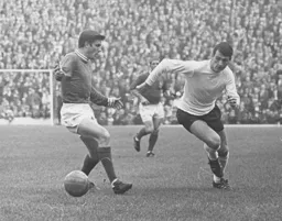 Bruce Rioch has the beating of the Cobblers defender